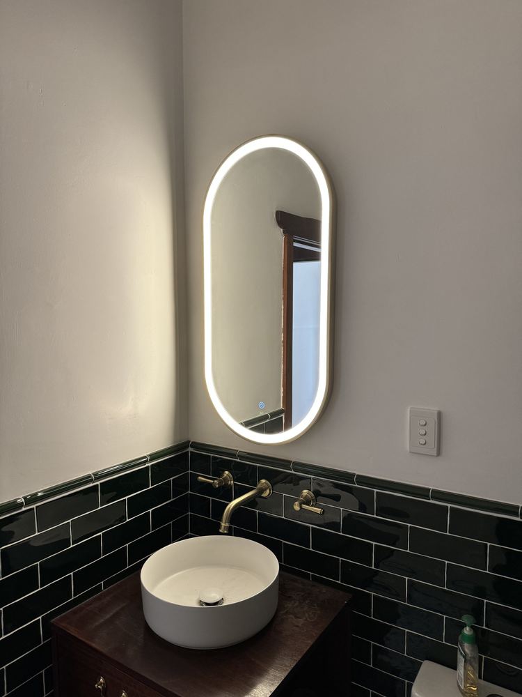 LED mirror installation in a renovated bathroom
