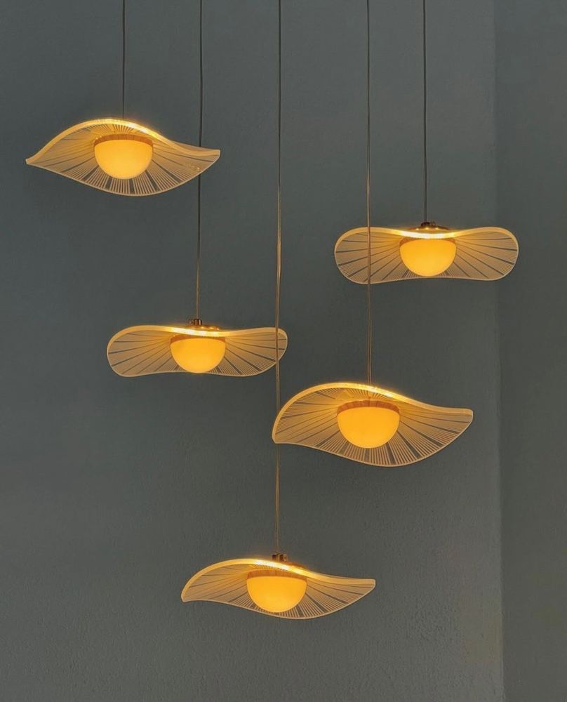 Designer pendant lights over a kitchen bench